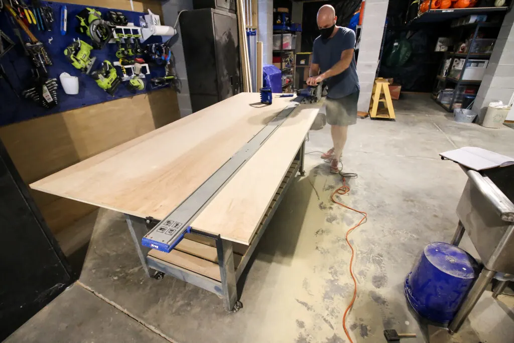 Cutting strips off plywood sheet
