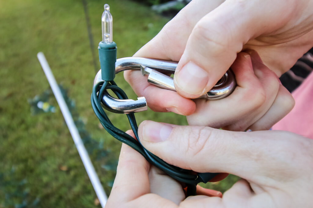 Clipping string lights onto spring snap