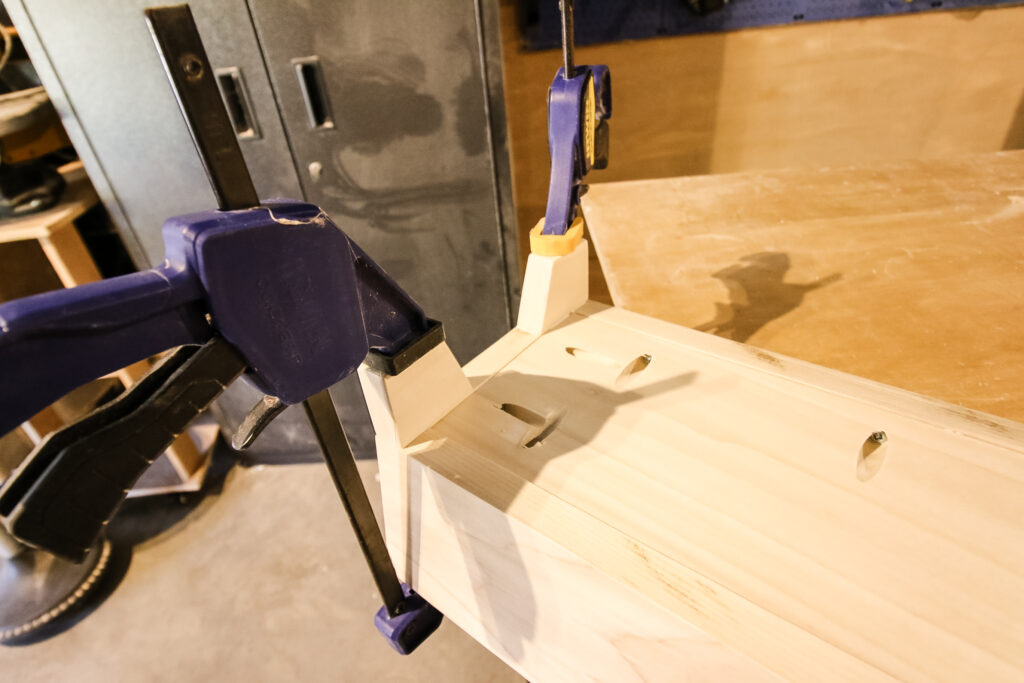 Legs attached to base with clamps
