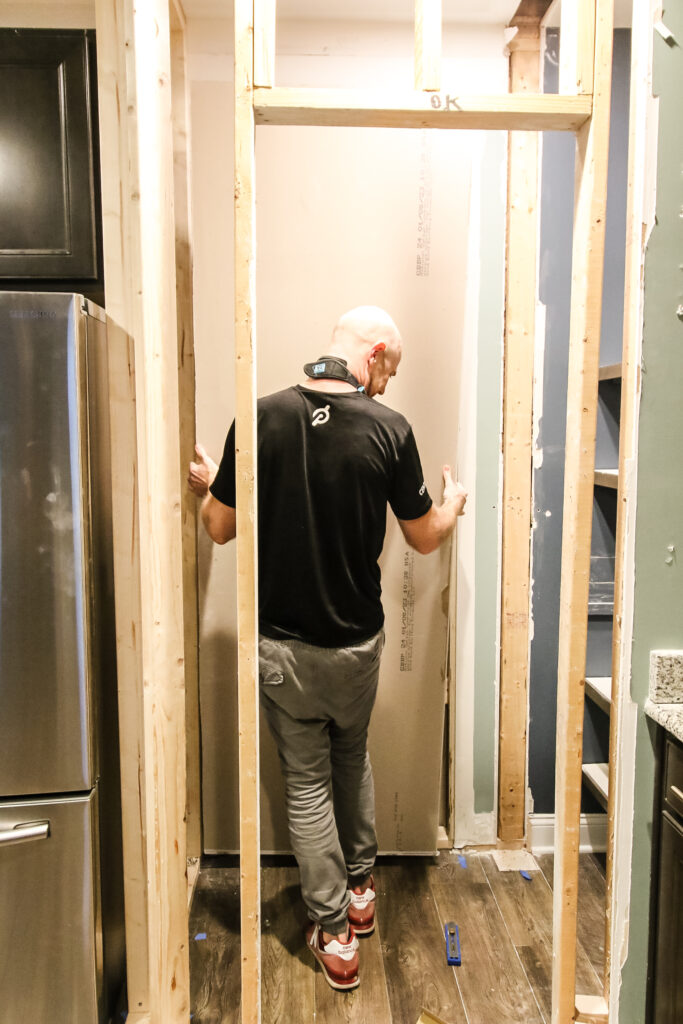 Installing drywall in new pantry