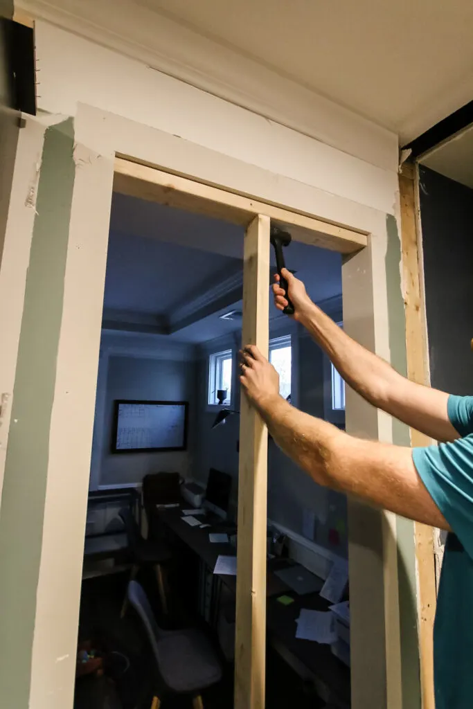 Centering vertical stud when closing off doorway