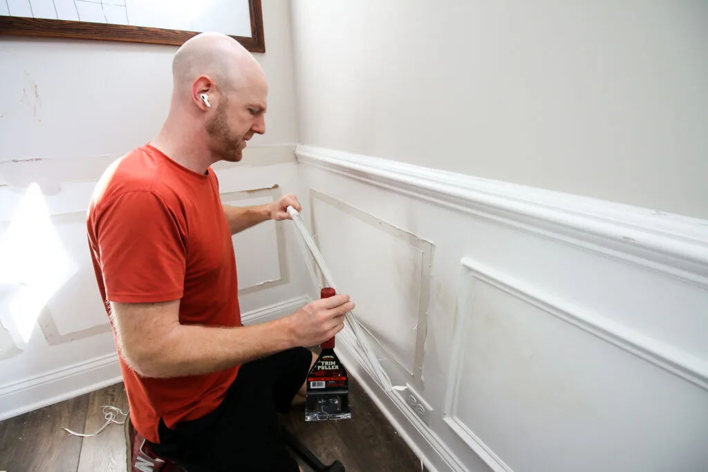 Pulling wainscoting off wall