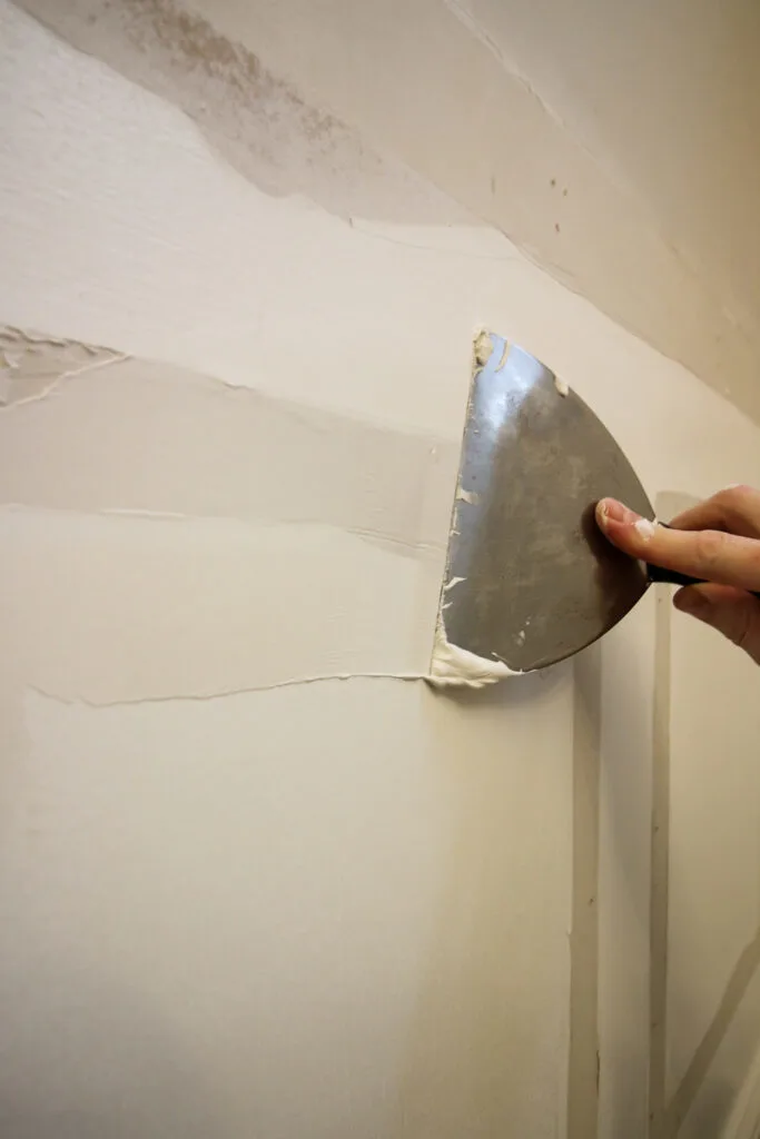 Applying joint compound to wall