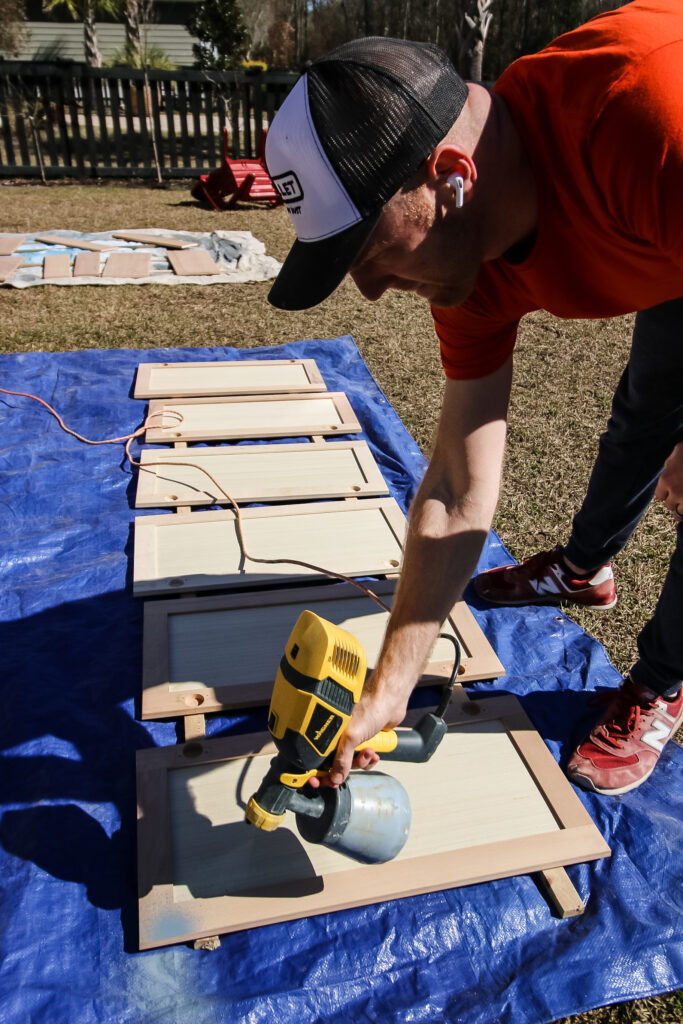 using a paint sprayer to paint cabinet doors