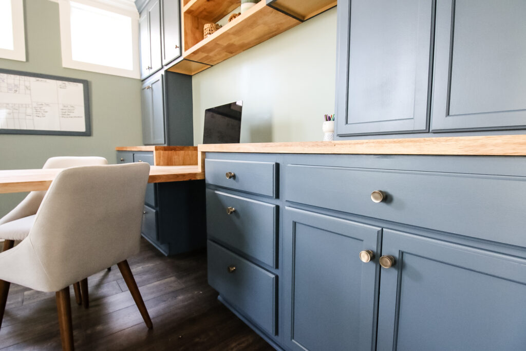 Gold hardware on built-in office cabinets