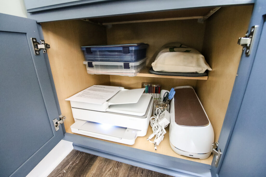 Printer stored in cabinet