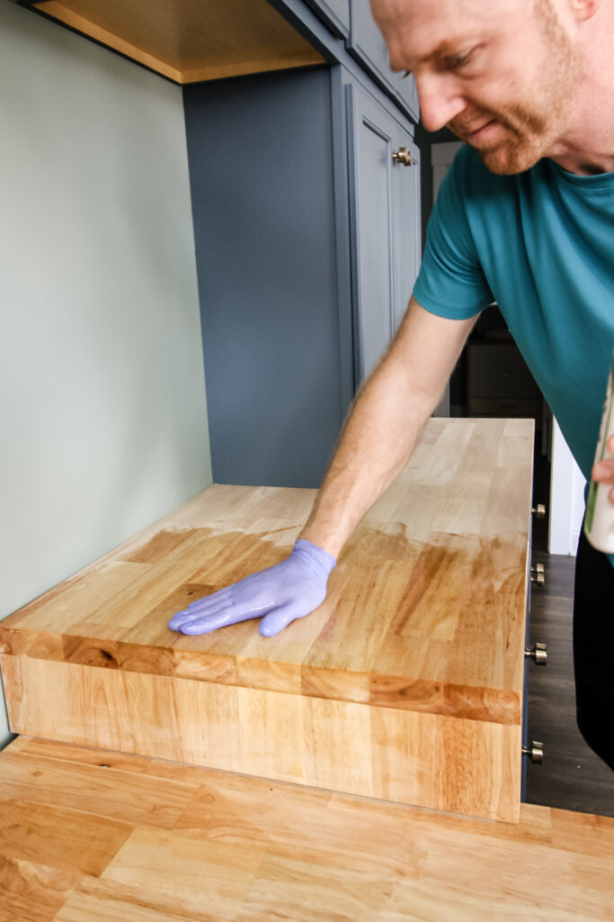 Applying tung oil to butcherblock