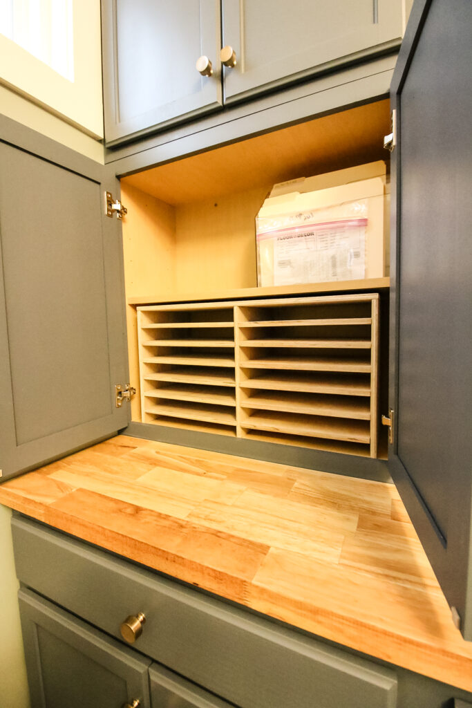 DIY paper tray organizer in cabinet