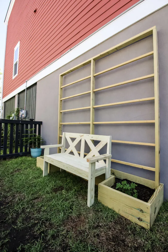 Simple DIY garden bench with raised bed garden