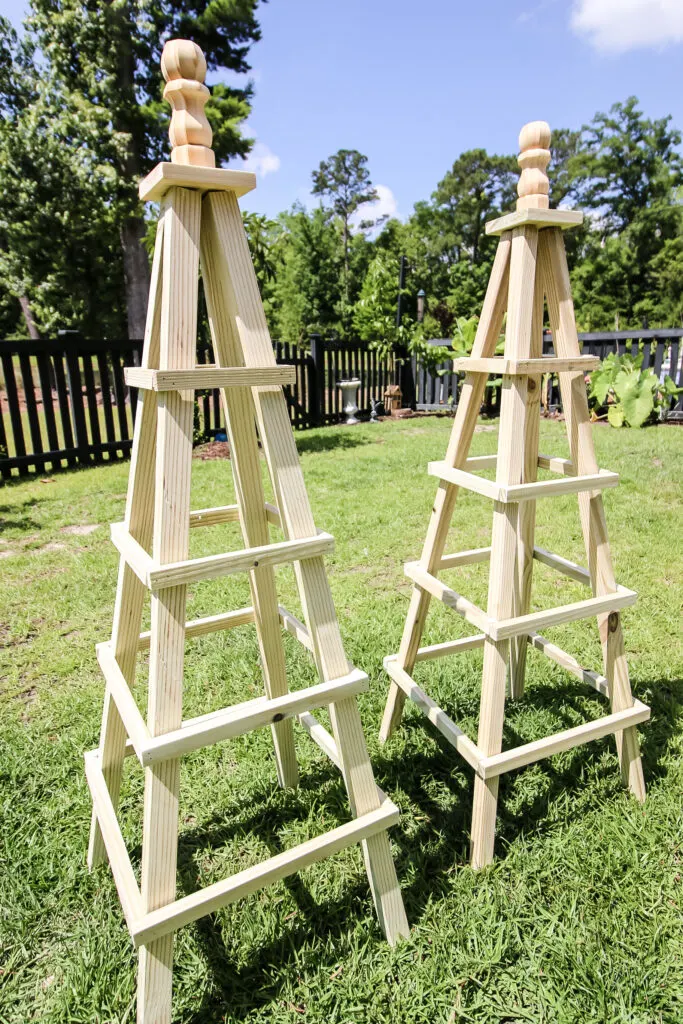 Wooden tomato cages in yard