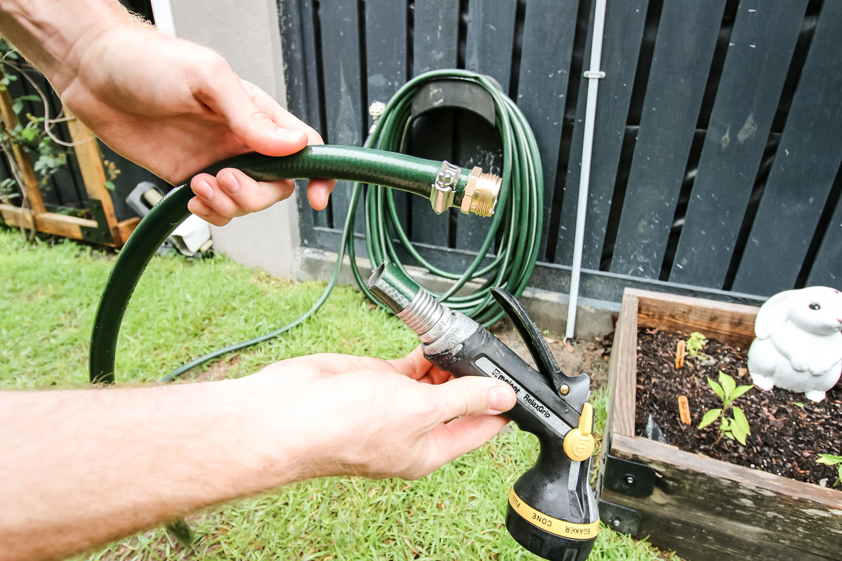 Garden hose connector attached to hose