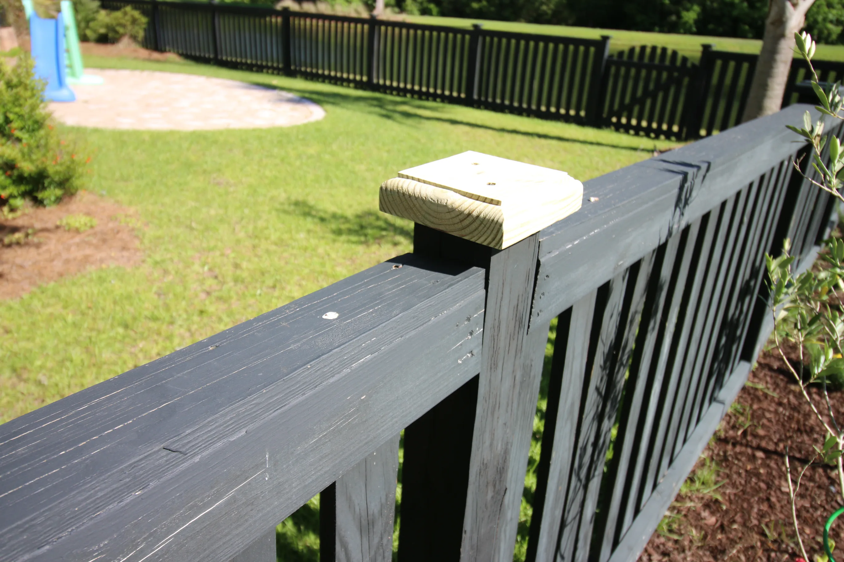 New fence post cap attached to fence