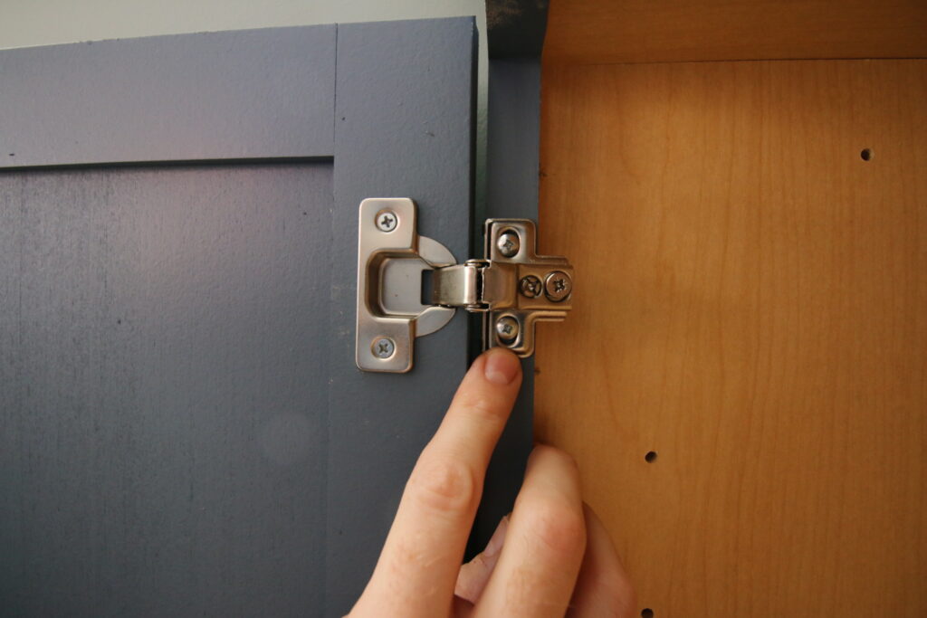 Screws to adjust cabinet doors up and down