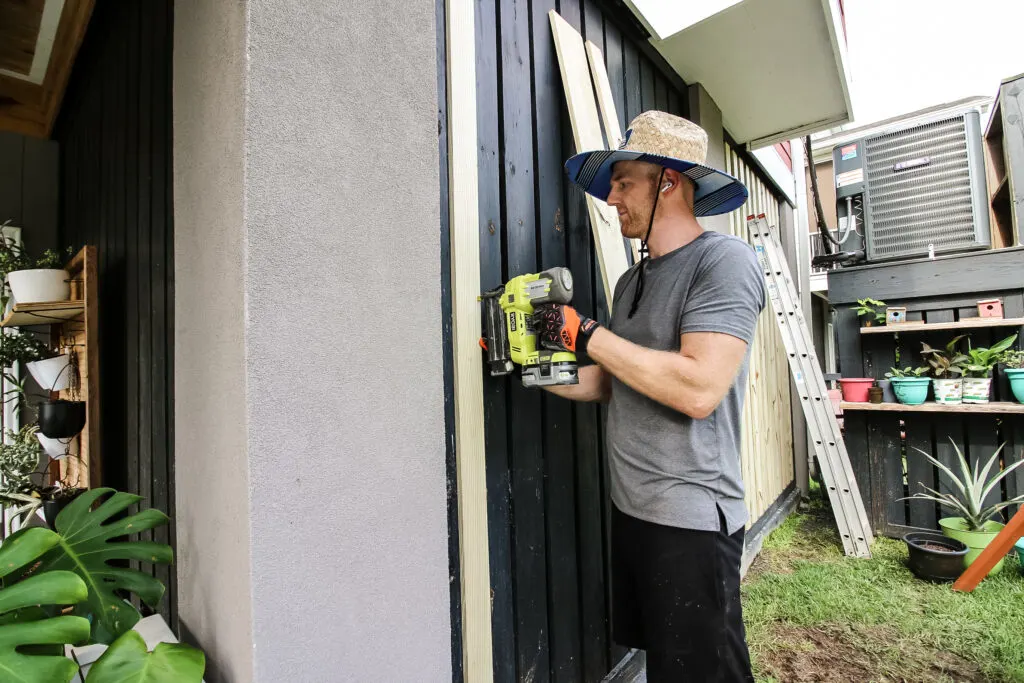 Nailing boards into place over slats