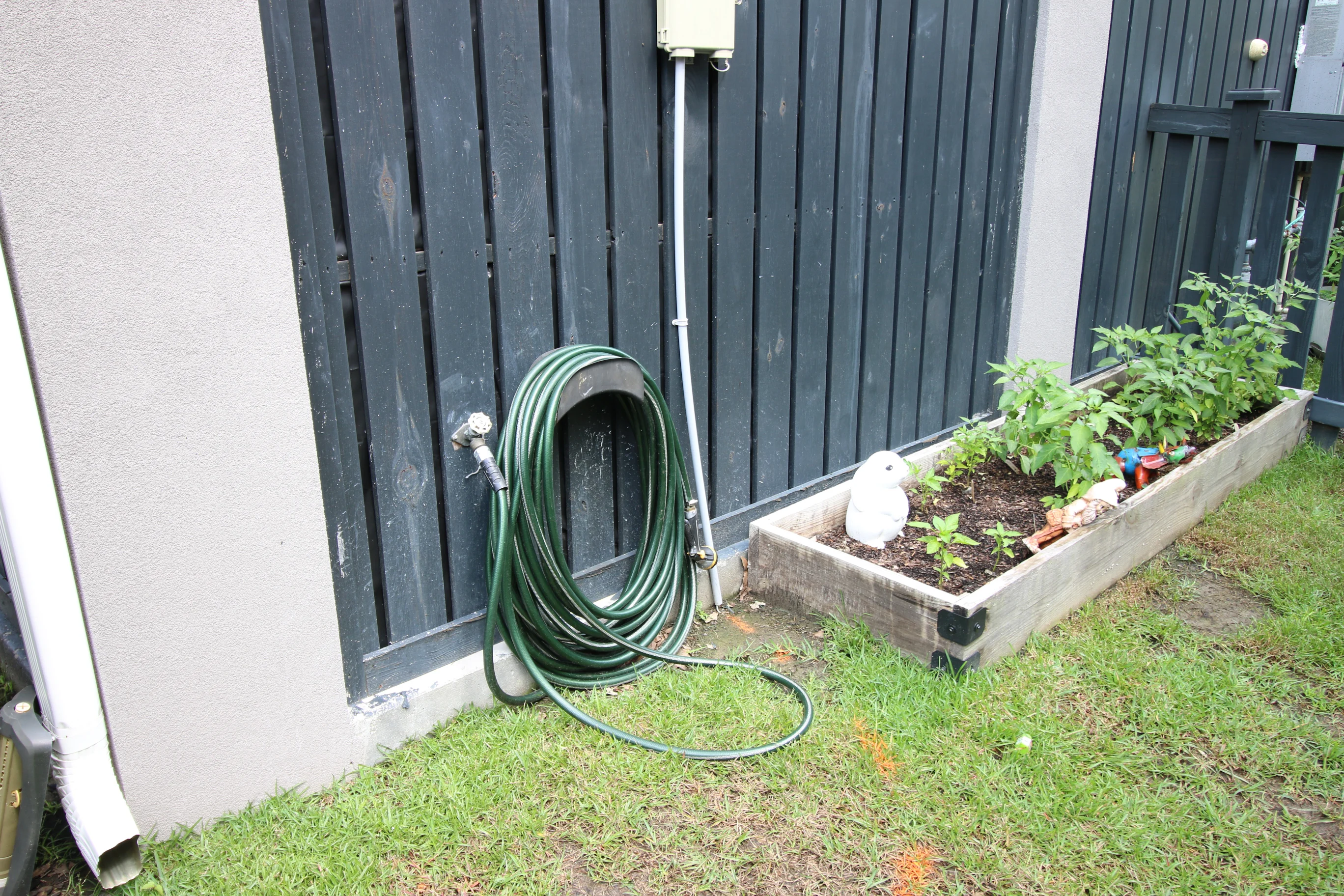 Old hose on hanger in garden