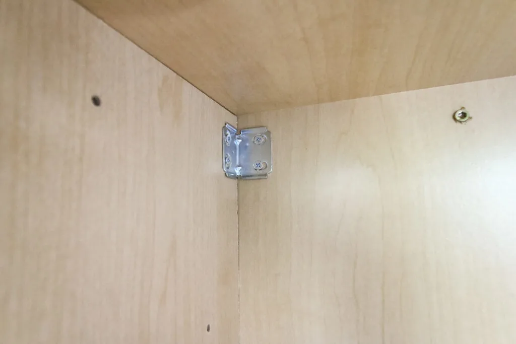 Corner brace in cabinet