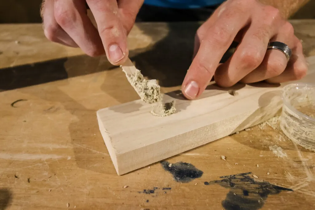 Applying DIY wood filler to holes
