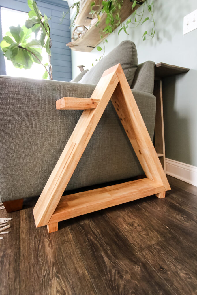 Pyramid side table next to couch