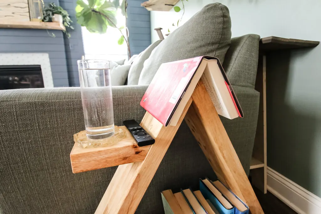 Book open on end of triangular side table