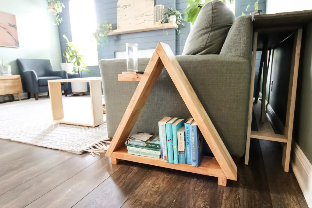 Triangular side table next to couch