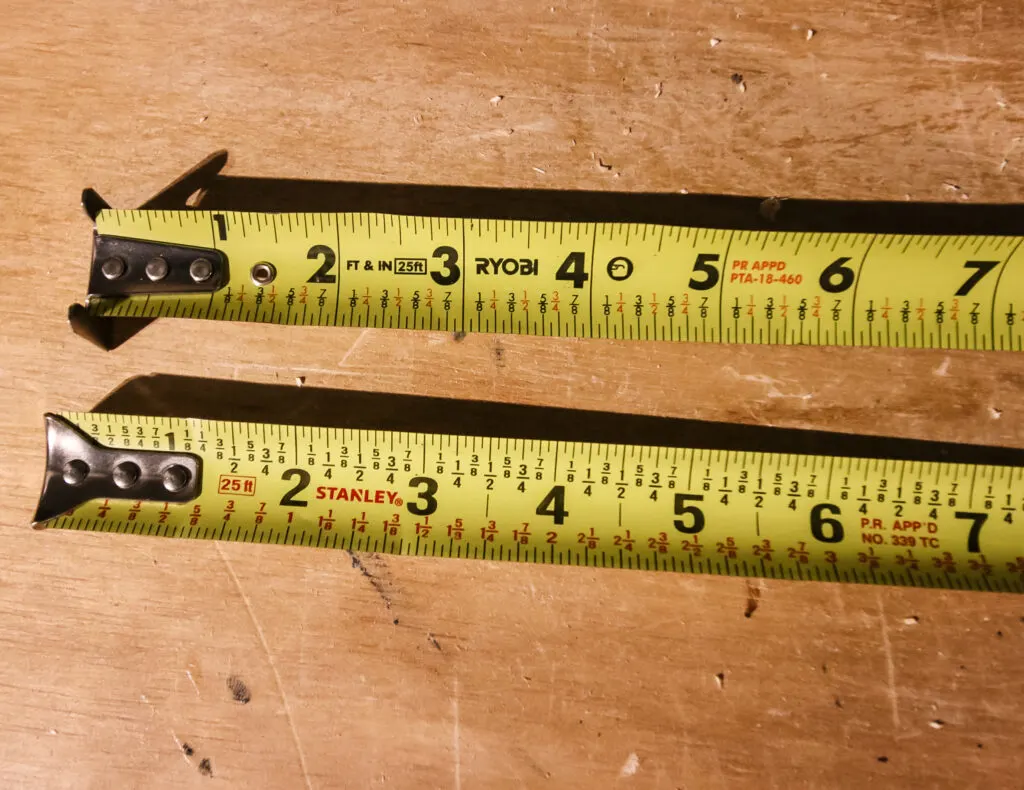 two tape measures pulled out side by side