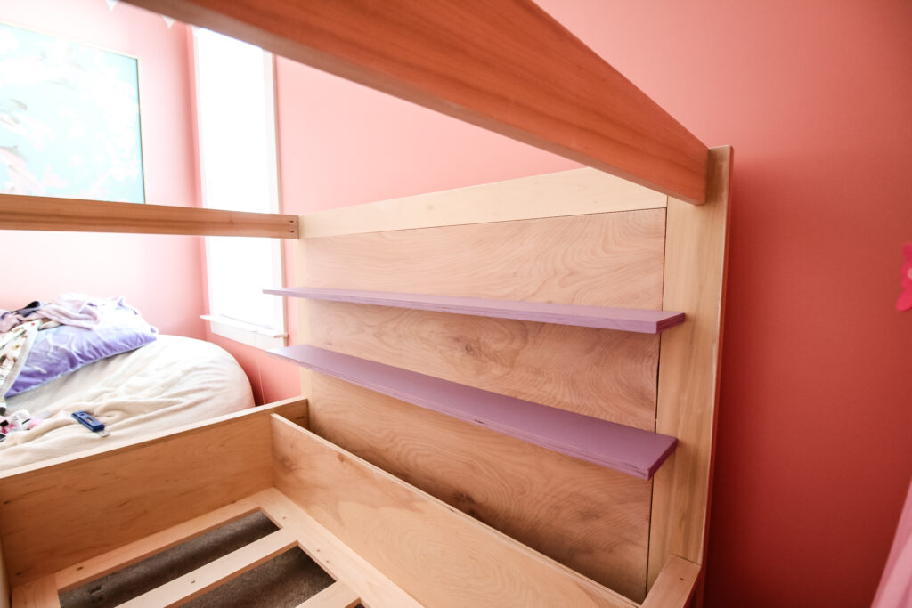 Shelves on kids house bed