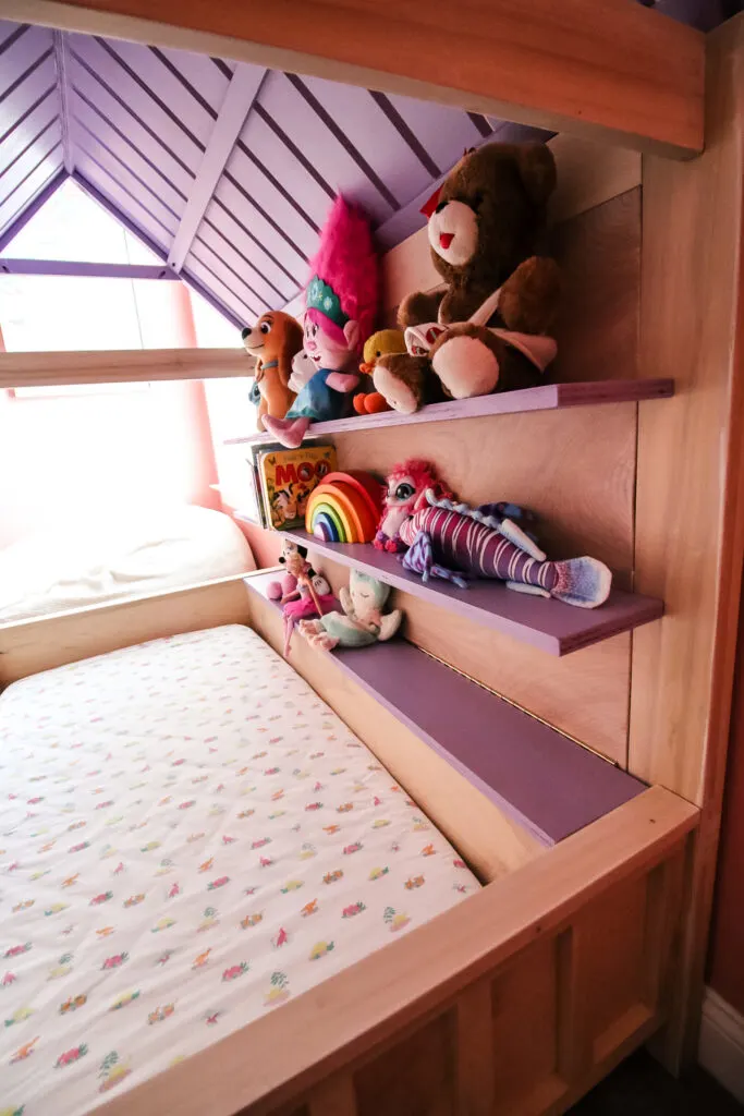 Shelves on DIY kids house bed