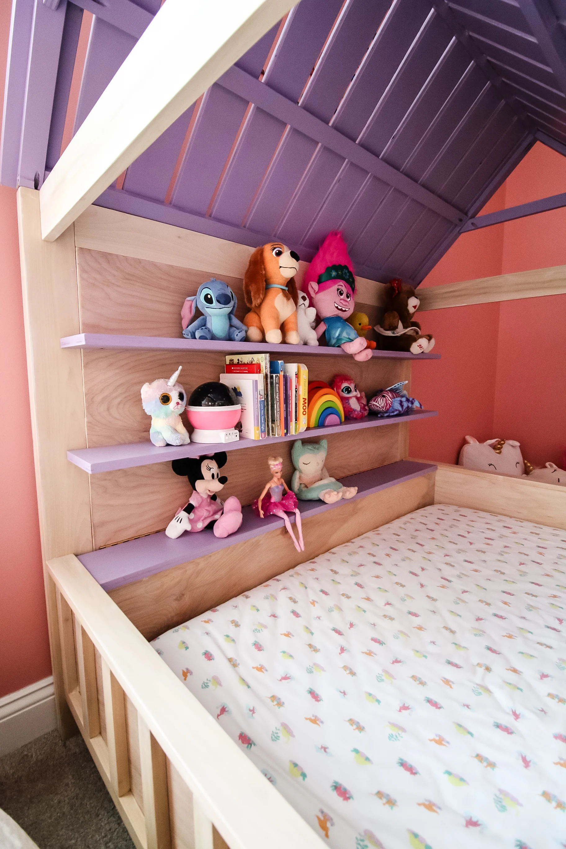 Shelves on kids house bed