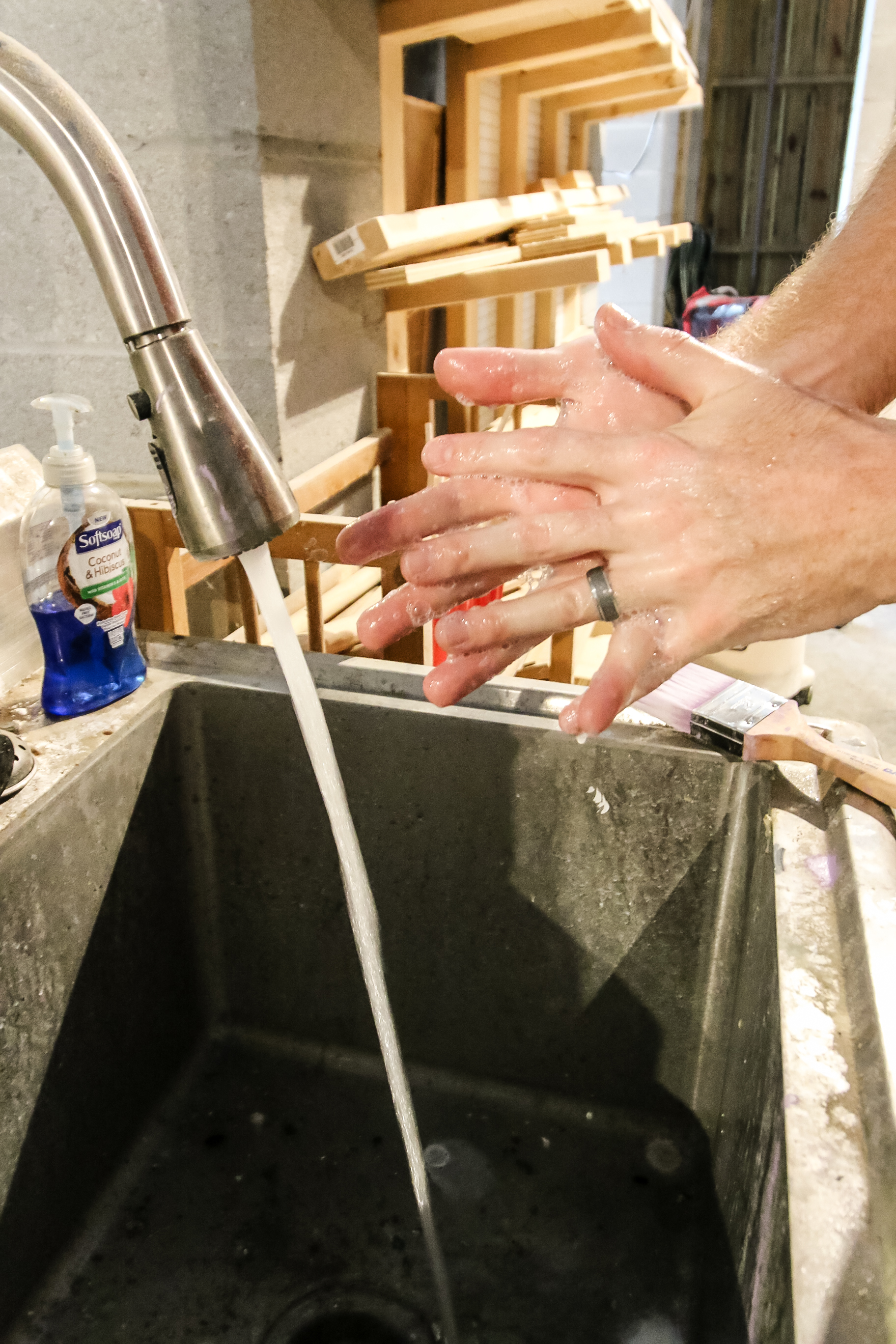 washing hands in garage utility sink