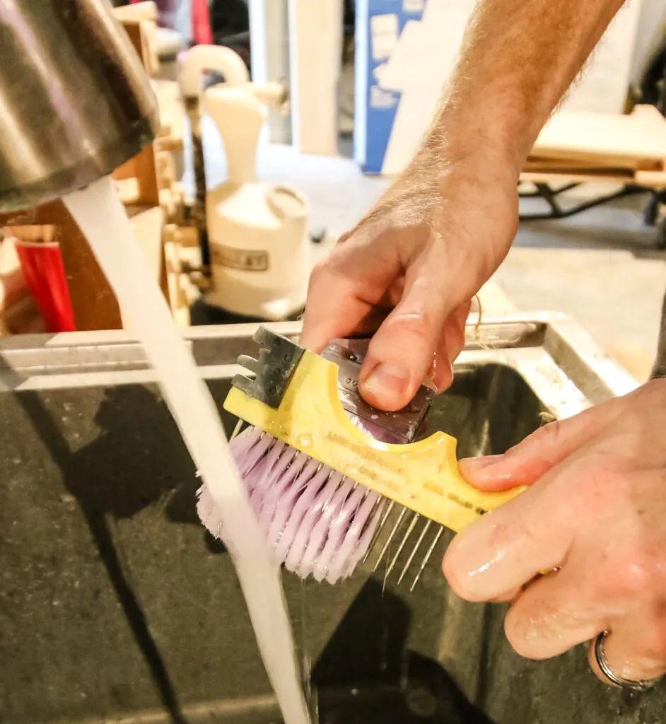 cleaning polyurethane off a paint brush with a comb