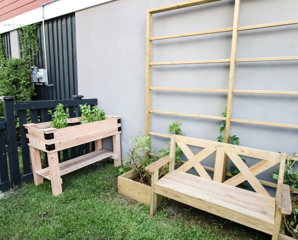 Garden bed with garden bench and trellis