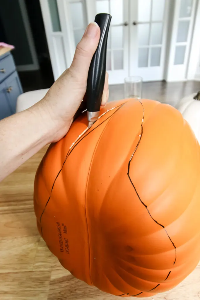 cutting pumpkins to make man eating pumpkins