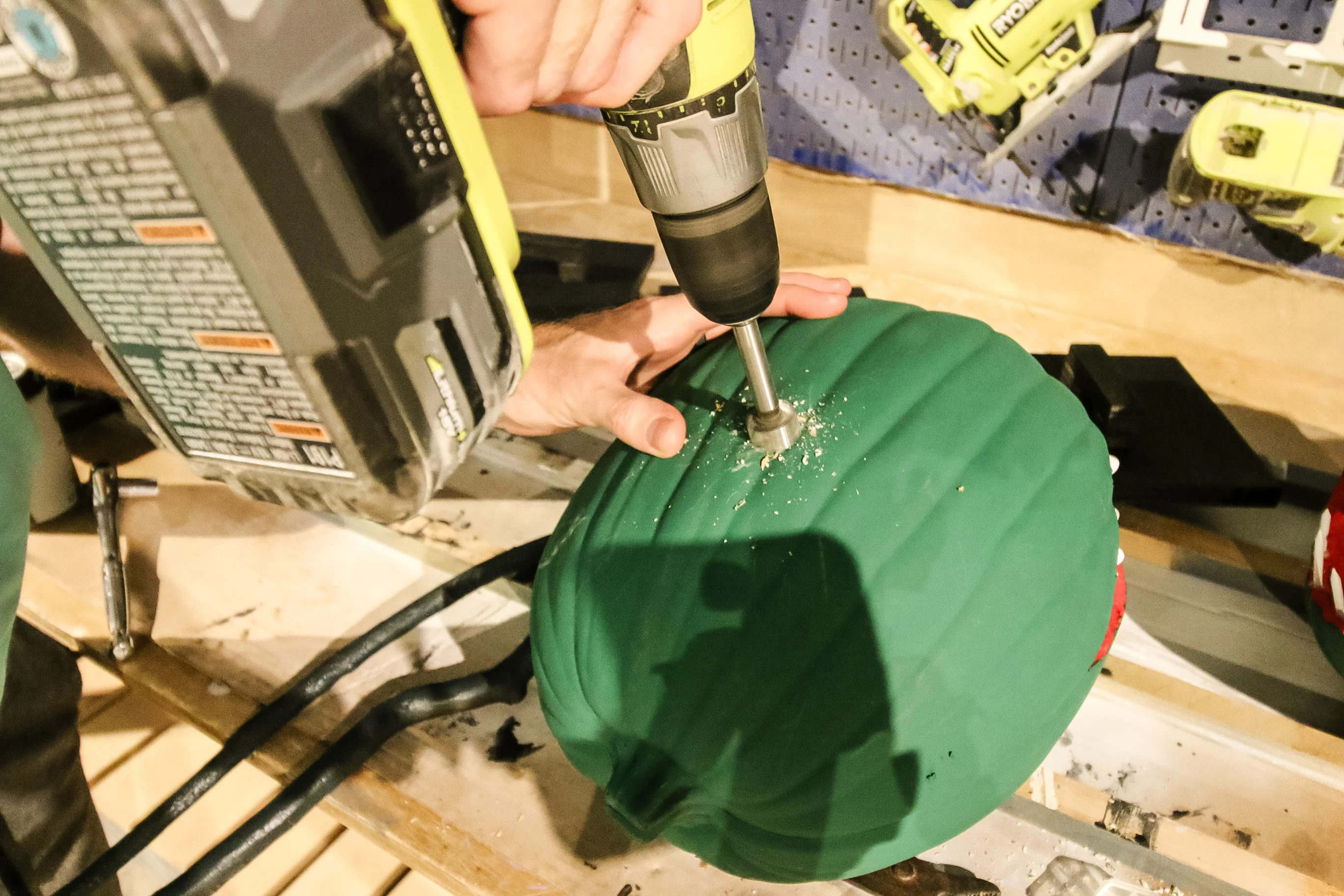 drilling a hole in a pumpkin