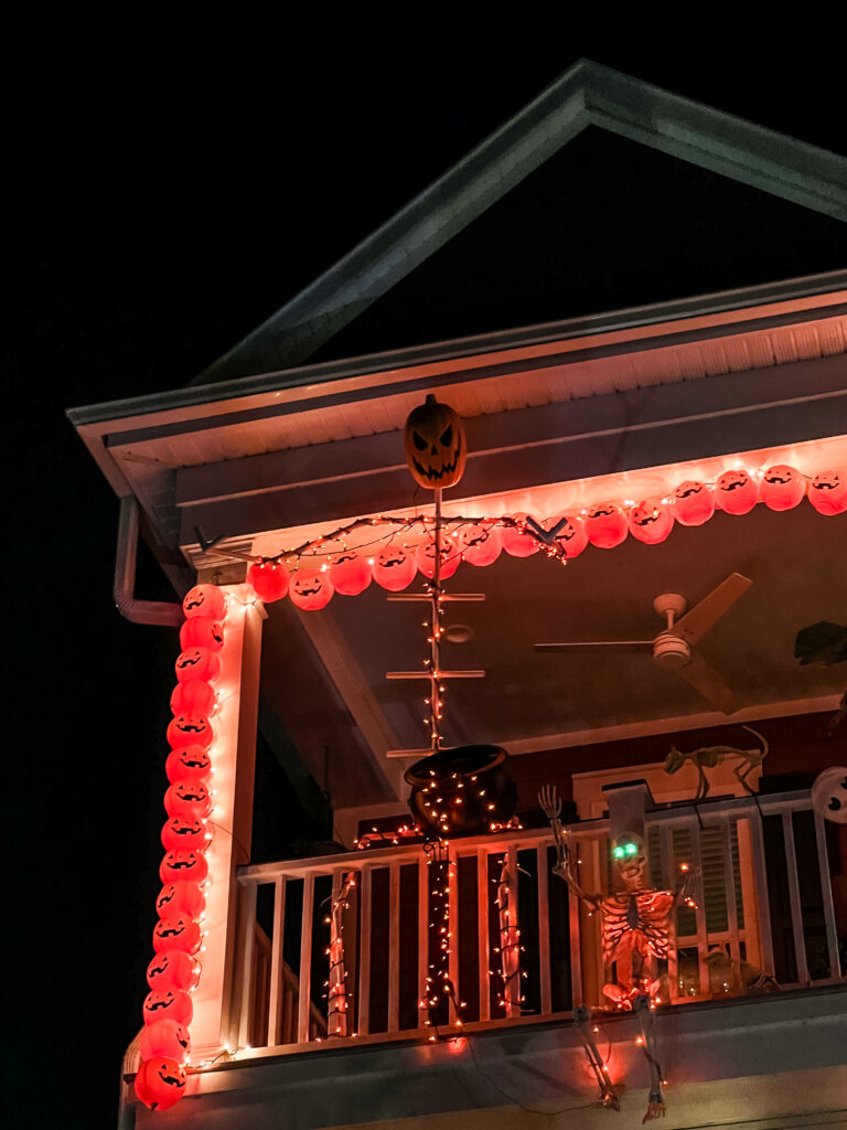 PVC skeleton on porch at night