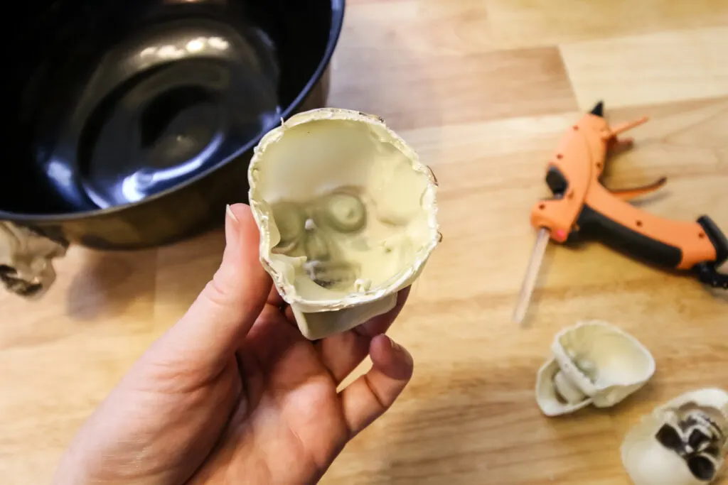 applying hot glue to skulls