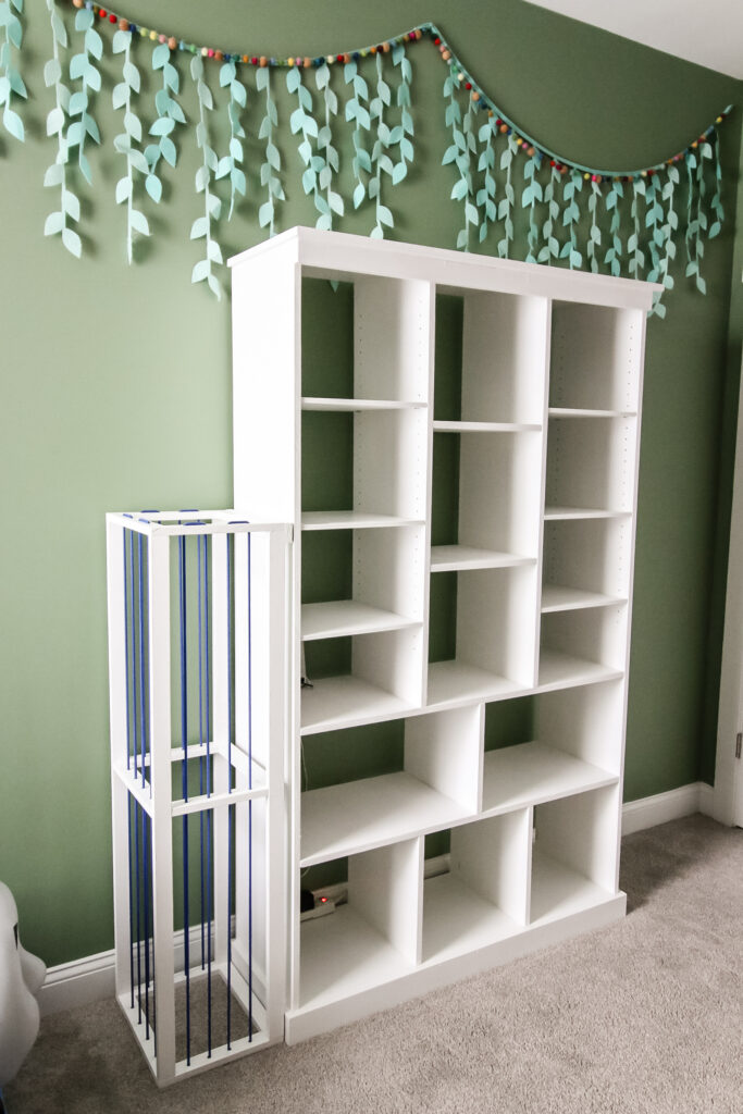 Empty bookcase before toys