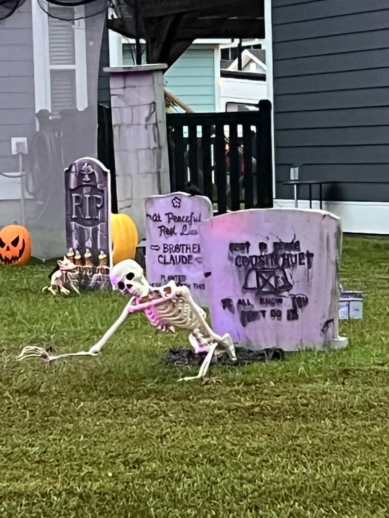 skeleton clawing out of the earth graveyard halloween decor