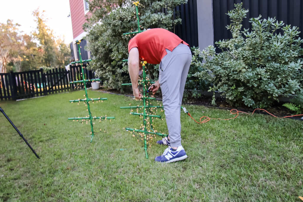 Wrapping lights on PVC pipe trees