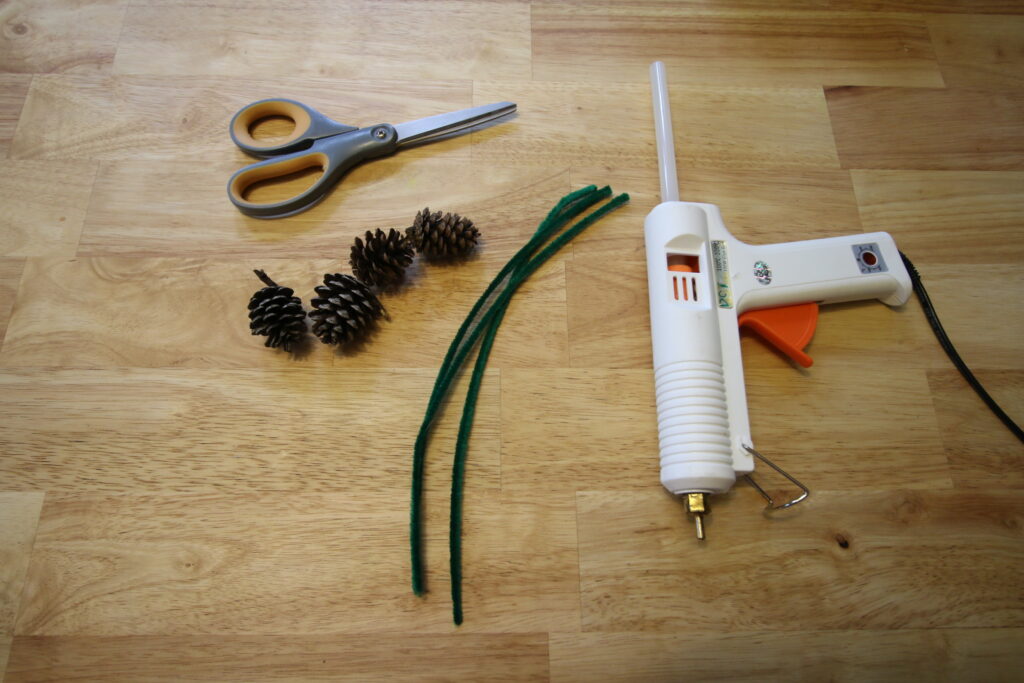 supplies needed to attach pine cones to christmas trees