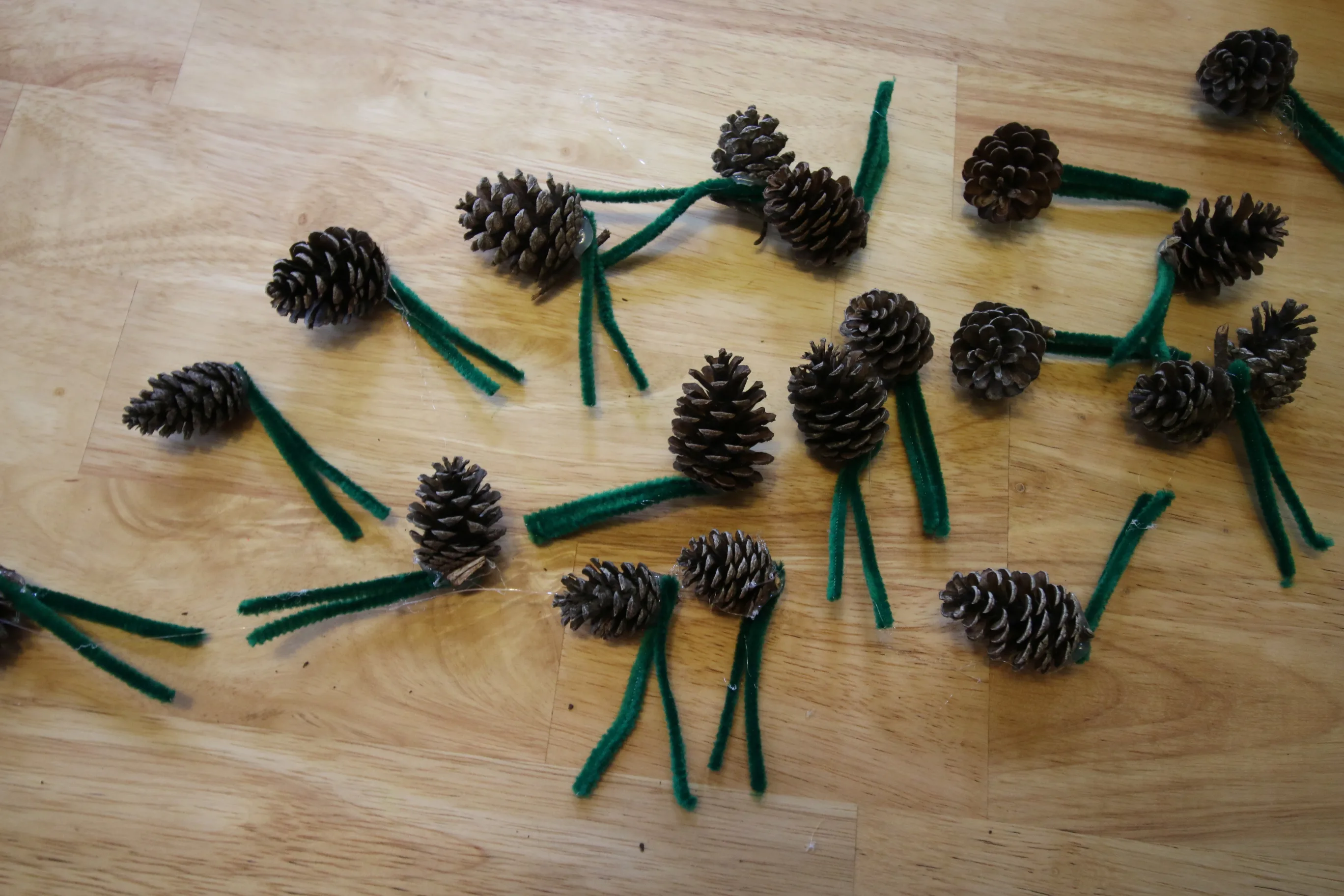 pine cones attached to pipe cleaners