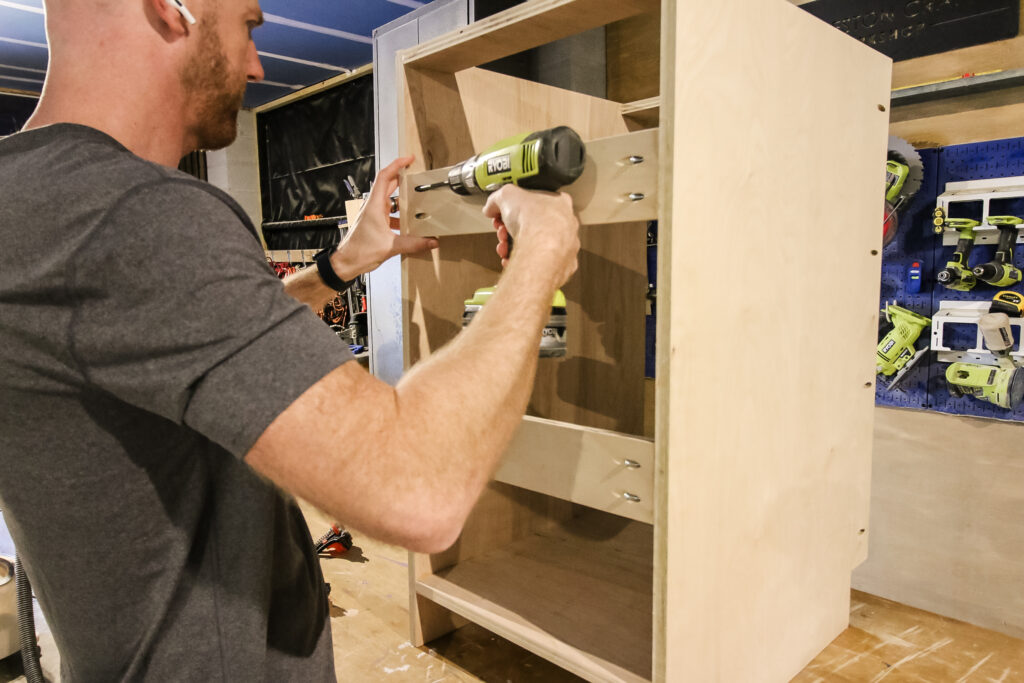 Attaching supports to base cabinets