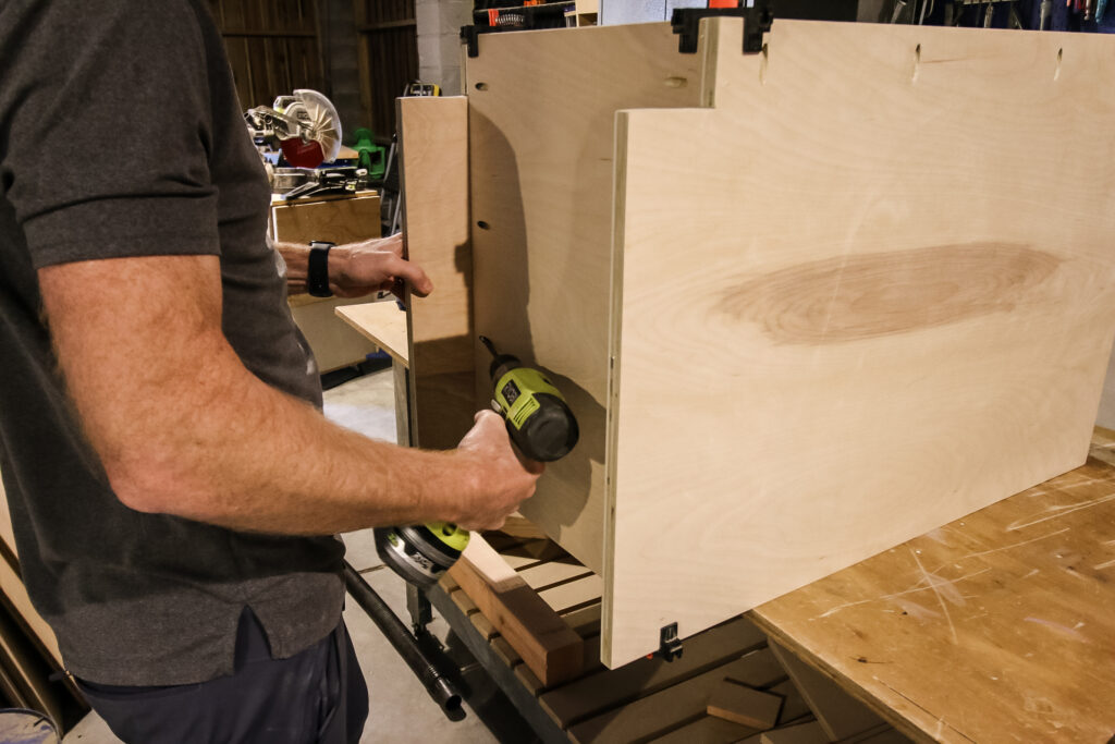 Attaching bottom to base cabinet