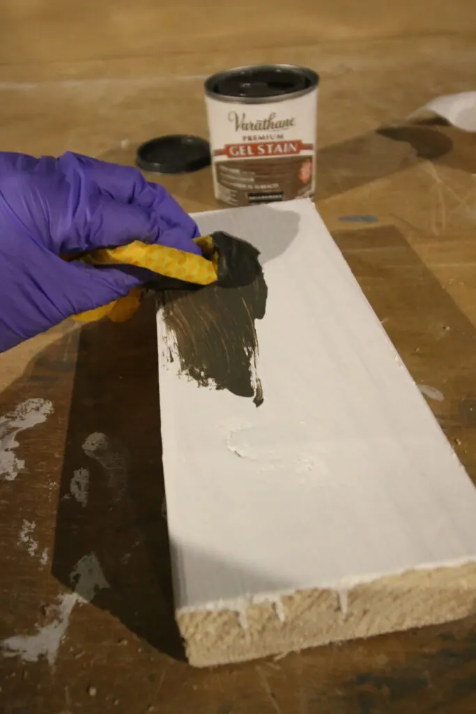 apply wood stain to wood board