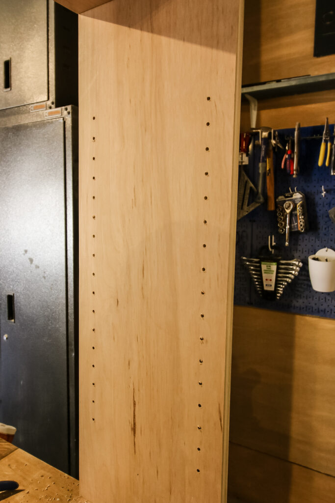 Shelf pin holes on cabinet