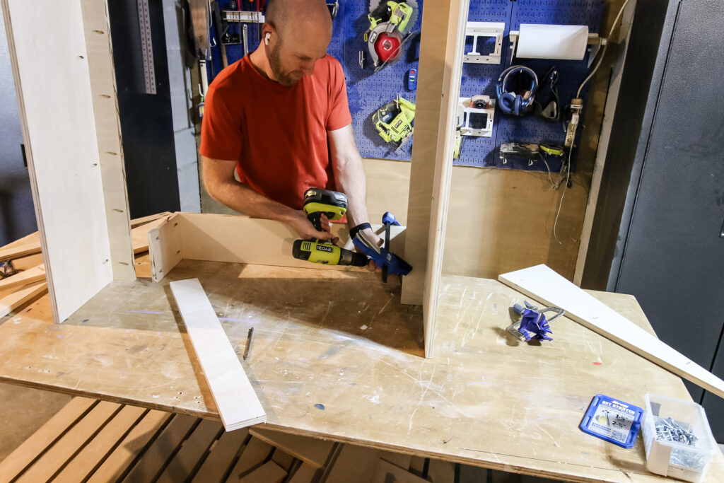 Attaching front panel to range hood