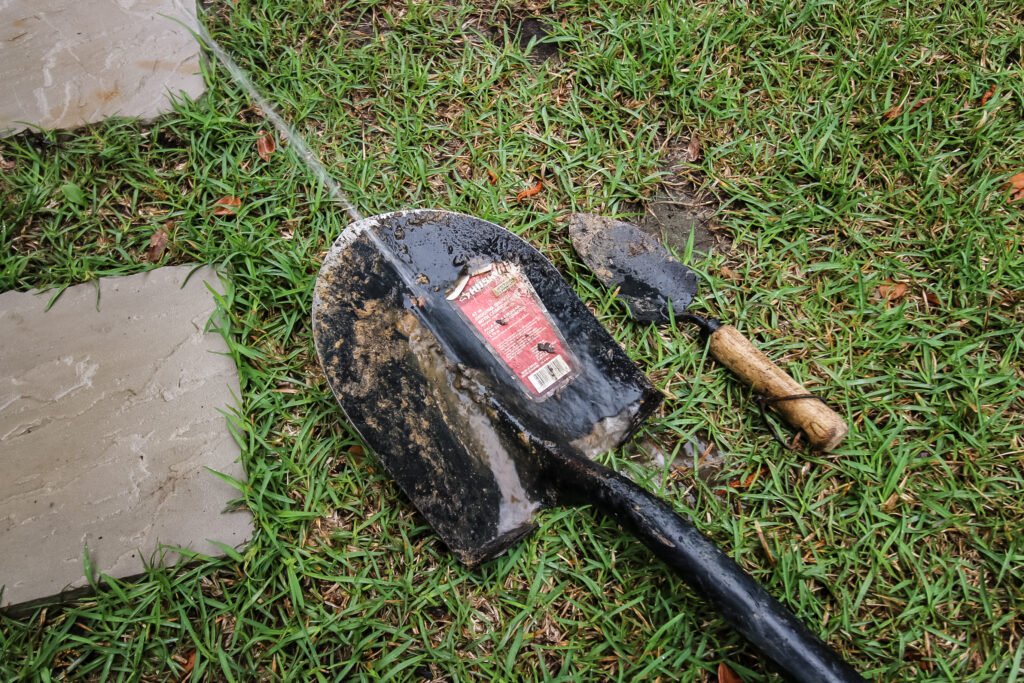 spraying down garden tools