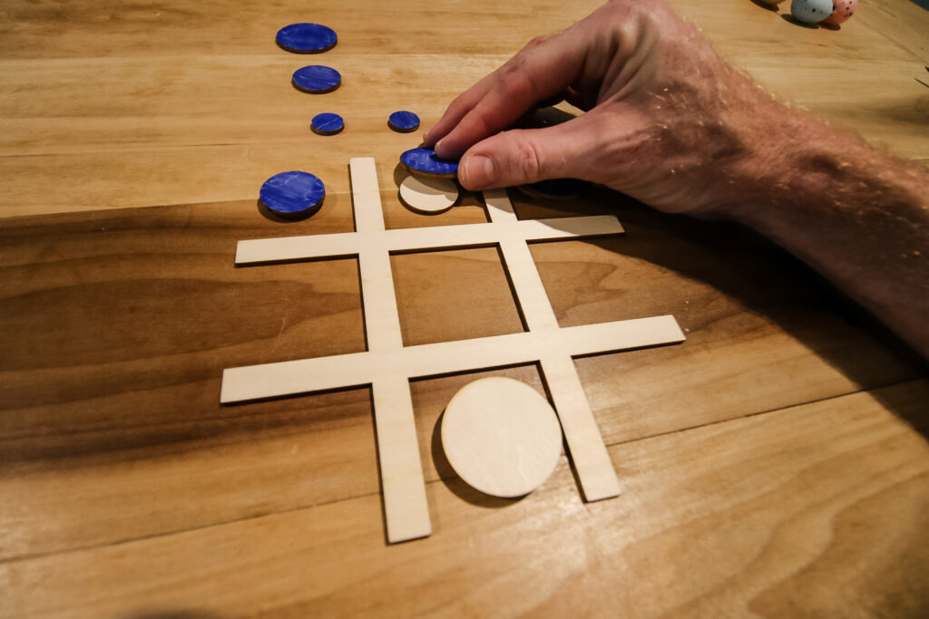 Playing big eats small tic tac toe