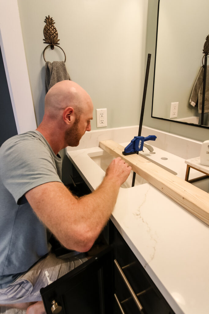 Clamping sink into place