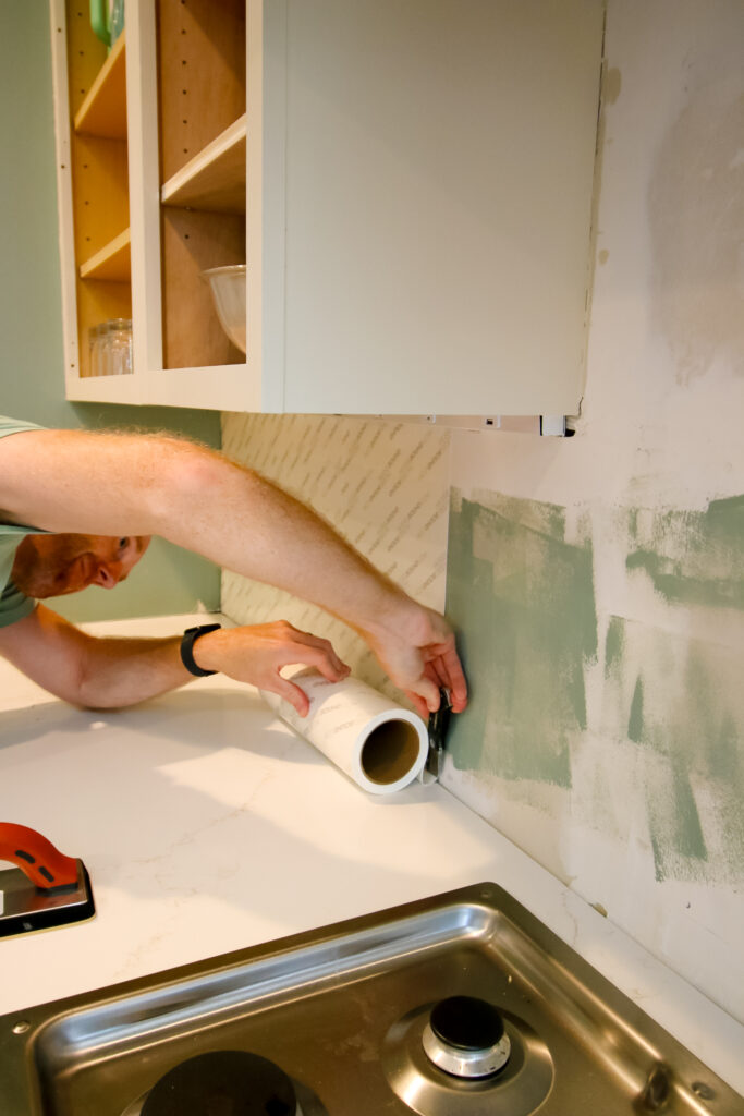 cutting musselbound peel and stick adhesive sheets with a utility knife