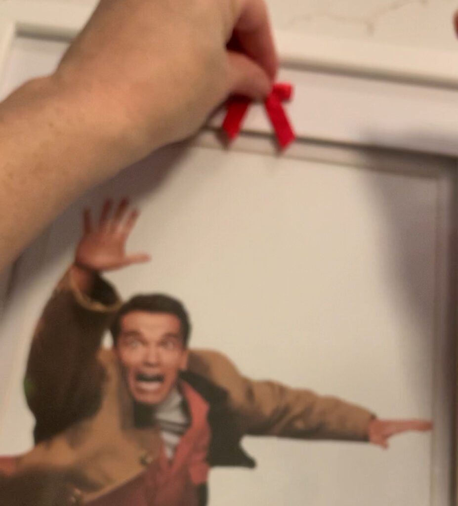 adding a bow to christmas frame